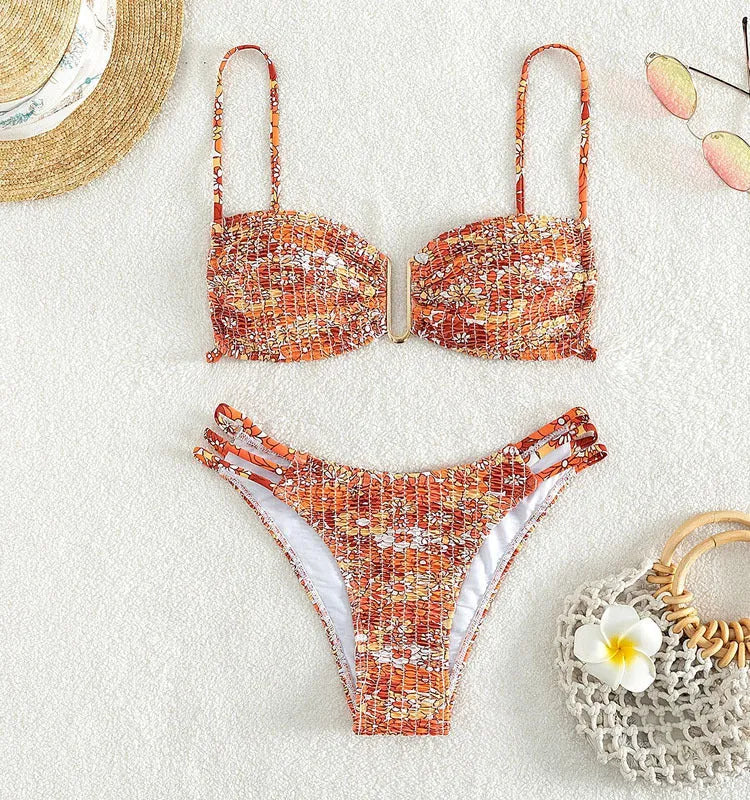 Women's floral bikini swimsuit with high-waisted briefs in solid orange colour