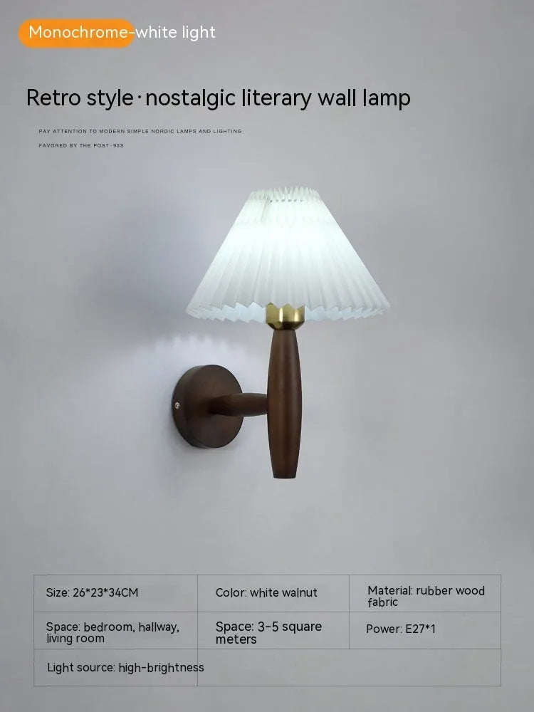 American retro wall lamp with a walnut wood base and white fabric shade mounted on a wall.