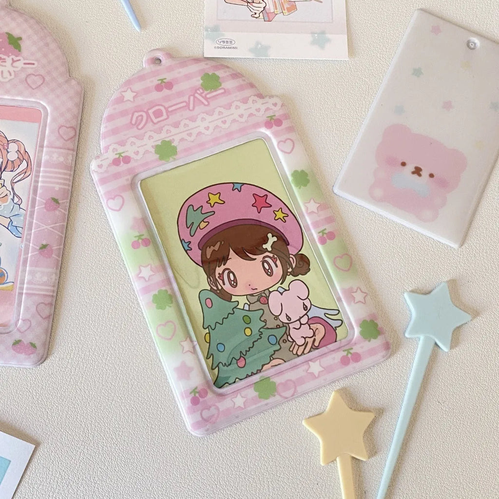 Cartoon strawberry or four-leaf clover PVC card holder measuring 7.6 by 13.6 centimetres.