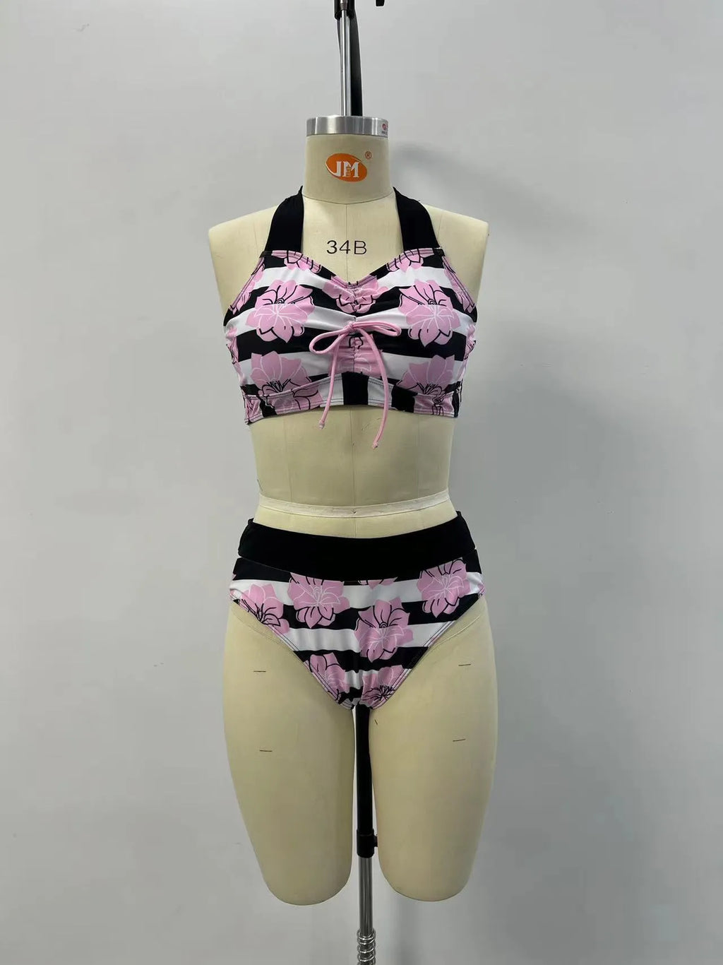 Black women's two-piece bikini swimsuit with printed belly cover design.