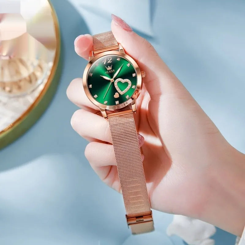 Rose gold alloy women's watch with mesh strap showing six dial colour options: white, black, blue, red, pink, green.
