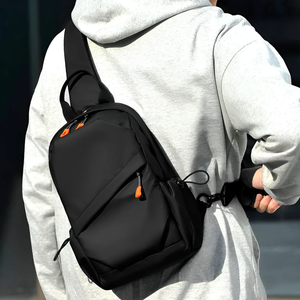 A black men's single shoulder crossbody bag made from polyester fabric.