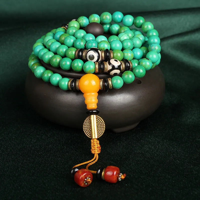 Natural turquoise bracelet with 108 polished 8mm round beads showing raw ore texture
