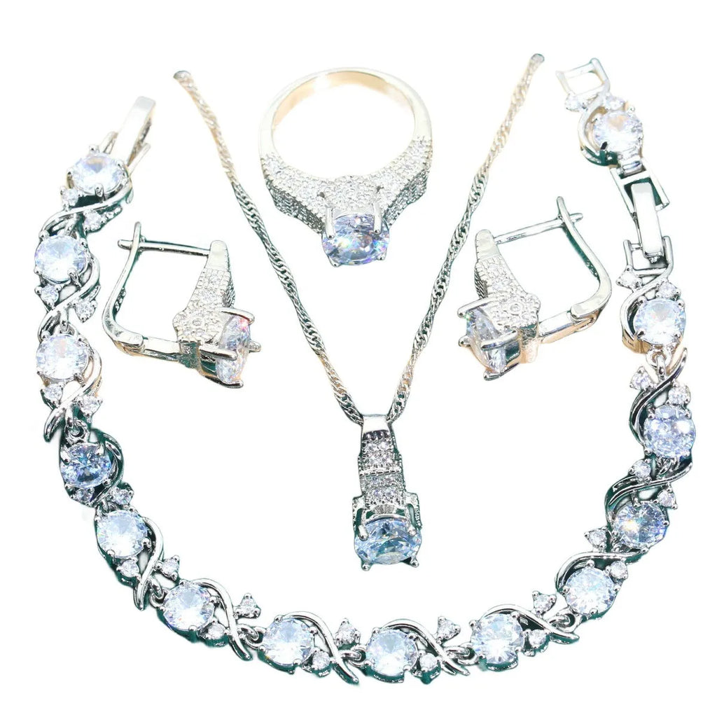 Bridal jewellery set with zircon accents showing necklace, earrings, ring, and bracelet in alloy construction