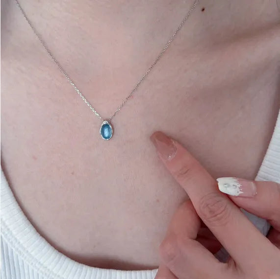 Women's navy blue water drop pendant necklace with geometric copper pendant and cross chain design