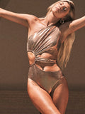 Women's gold one-piece swimsuit with backless design and spandex lining for swimming activities