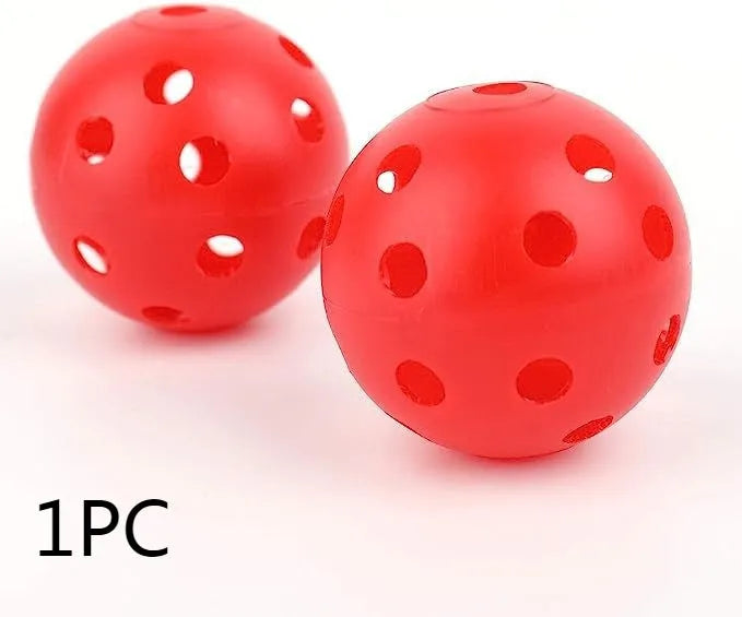 Multi-colour golf practice balls in red, orange, blue, green, white, and yellow packed in a net bag.