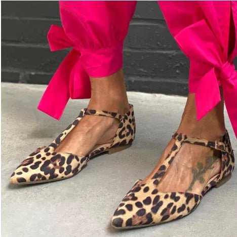 Women's leopard print pointed toe pumps with a low chunky heel and ankle straps.