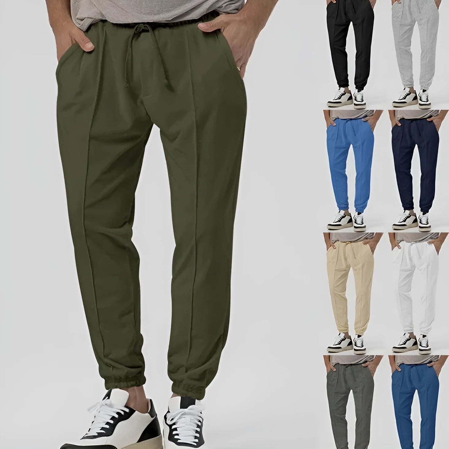 Men's grey straight-leg casual track sweatpants made from cotton blend fabric on a neutral background.