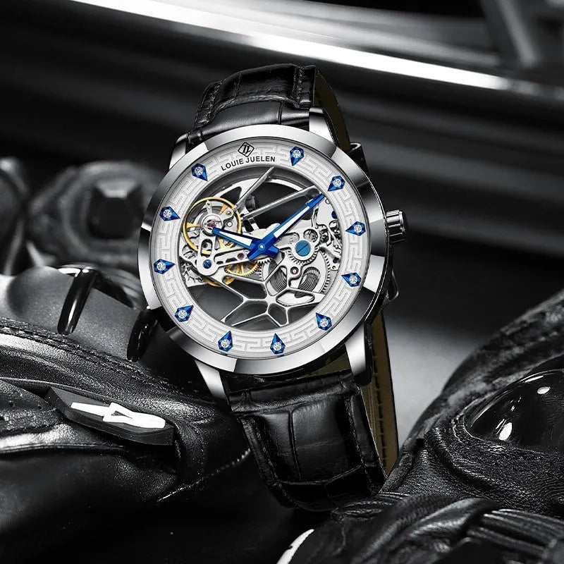 Men's silver mechanical watch with white dial, blue hands, black leather strap, and luminous markers