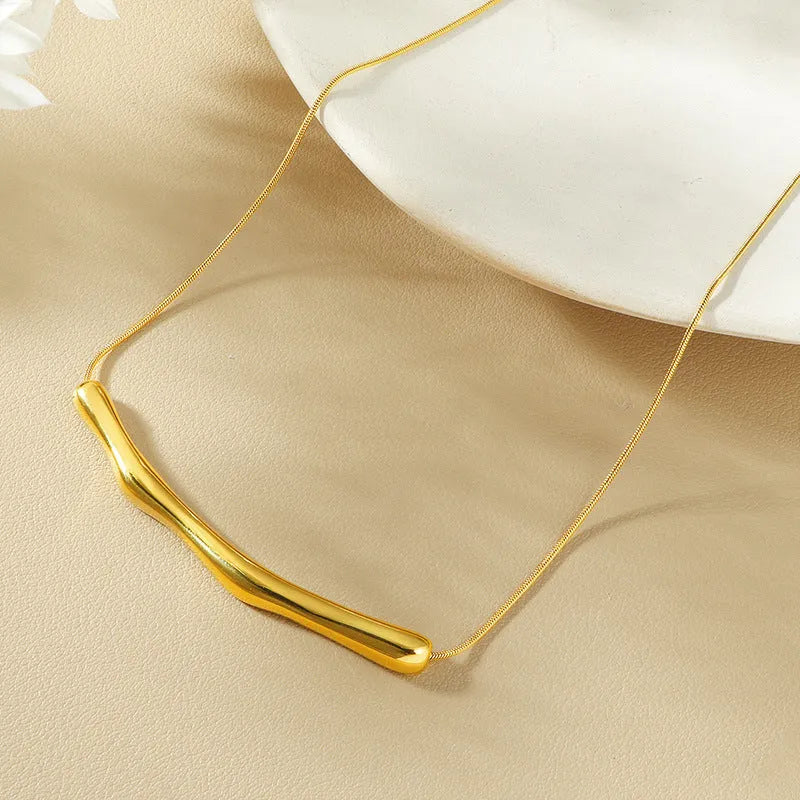 Women's titanium steel necklace with irregular pleated pendant in gold or steel electroplated finishes