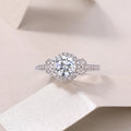 Lighthouse 1-carat moissanite wedding ring set with S925 silver platinum-plated band on display in gift box