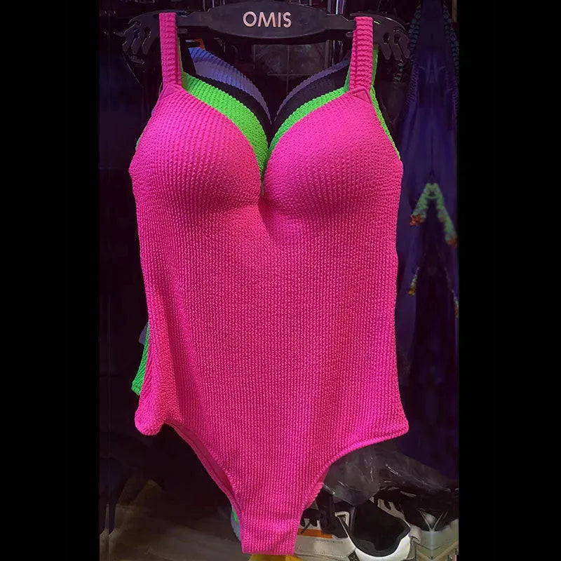 Women's black sleeveless one-piece swimsuit with a sunkissed stripe pattern on a mannequin.