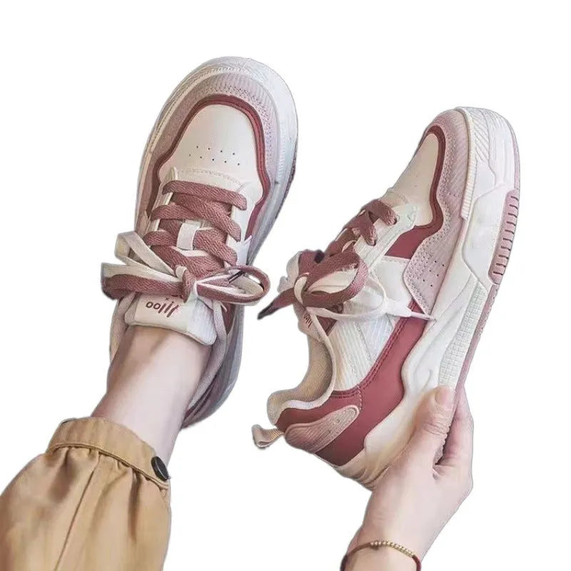 Low top rubber sneakers in pink and milky white with height-increasing design