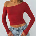 Women's slim fit knitted cardigan with long sleeves and cross shoulder straps in black colour