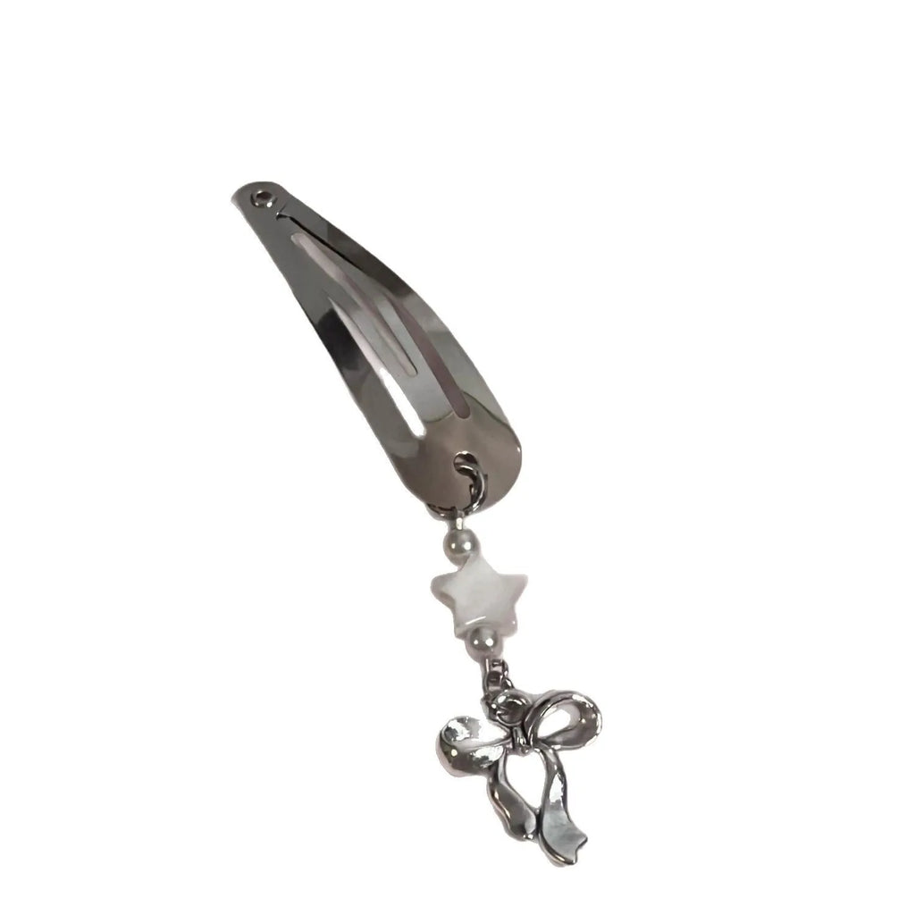 Silver metal alloy star bow hair clip with electroplated finish on neutral background