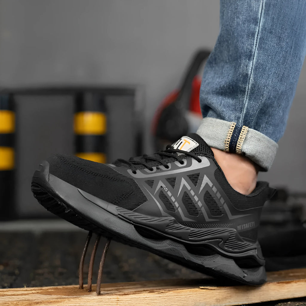 Black steel toe cap safety work shoes with flat knitted uppers and lace-up closure