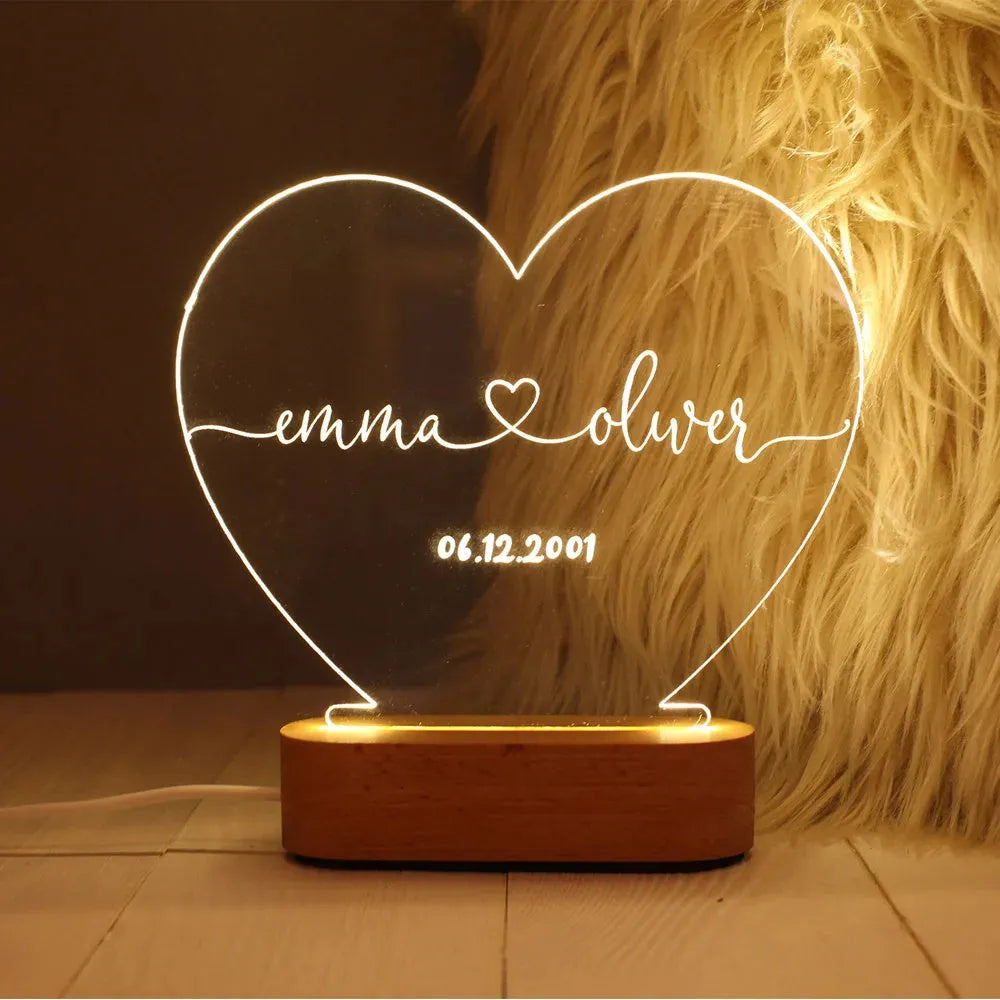 Custom acrylic night light with illuminated personalised names and dates for bedroom