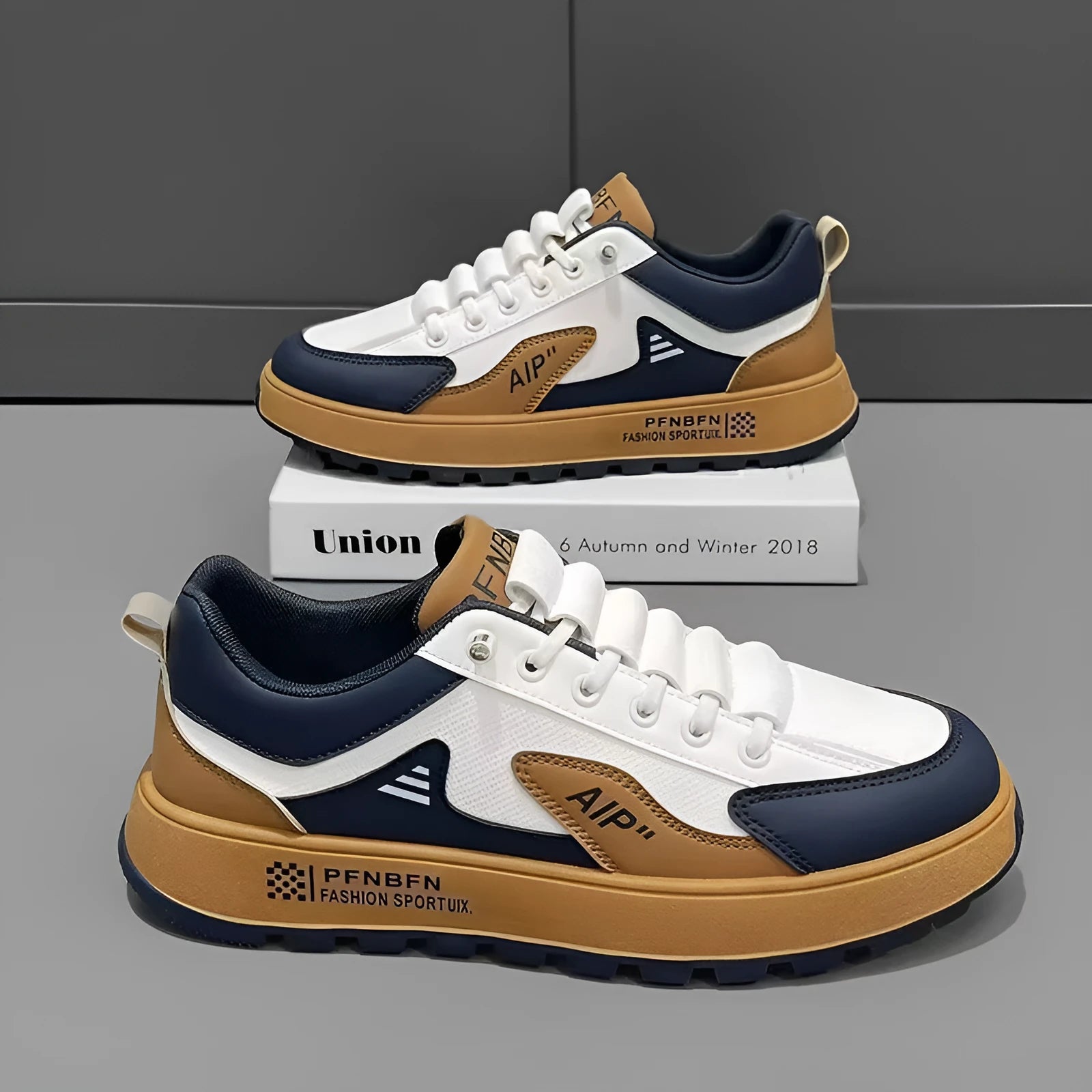 Men's white and black casual shoes with round toe and artificial PU upper.