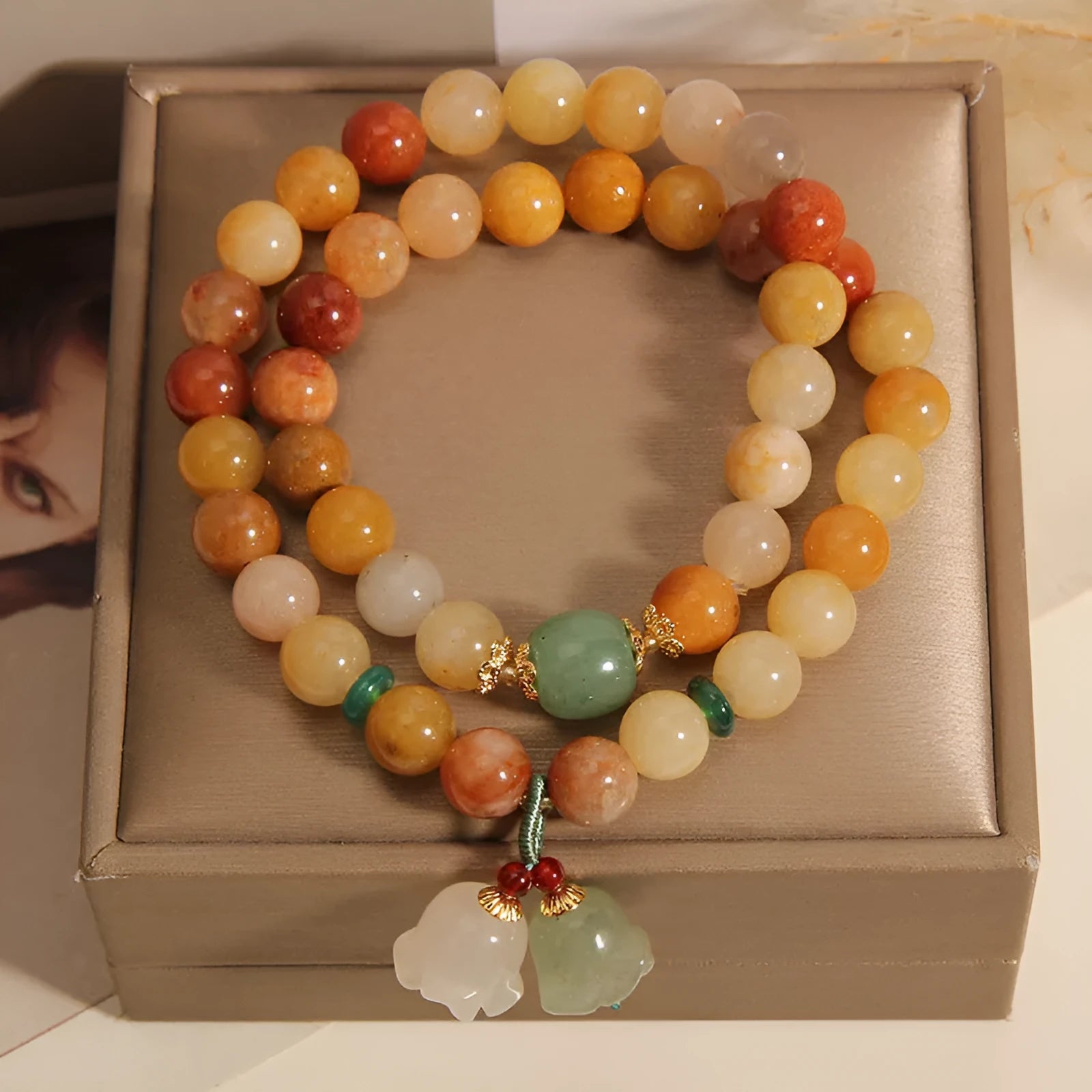 Natural jade multi-layer bracelet for women with a white orchid pendant charm on an elasticated cord