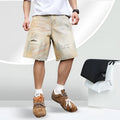 Light blue men's denim shorts with a washed finish and ripped detailing on a straight-leg cut.