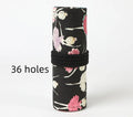 Square canvas rolling pencil case with ballet girl print, unrolled to show multiple pencil holes.