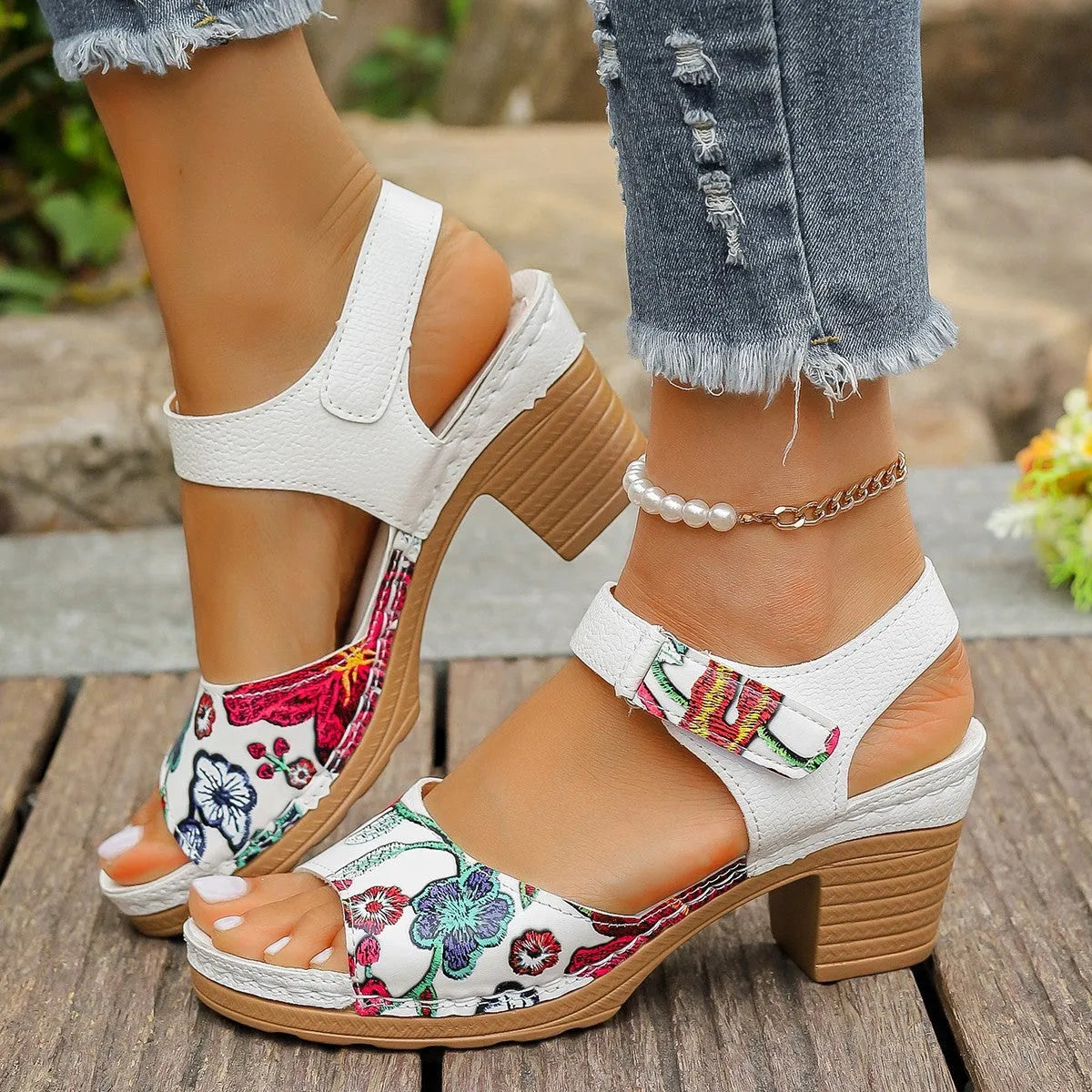 White women's high heel sandals with Velcro buckle fastening showing PU upper and rubber sole