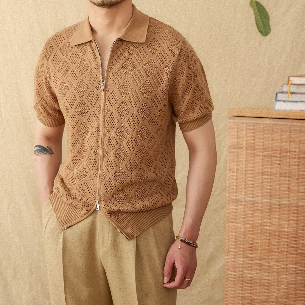 Light brown cotton short sleeve cardigan with lapel collar and front zipper on a hanger.