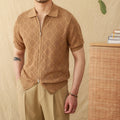 Light brown cotton short sleeve cardigan with lapel collar and front zipper on a hanger.