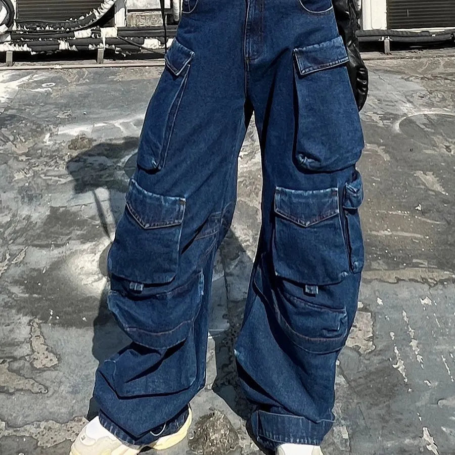 Distressed dark blue wide-leg jeans with high waist and multiple pockets on mannequin