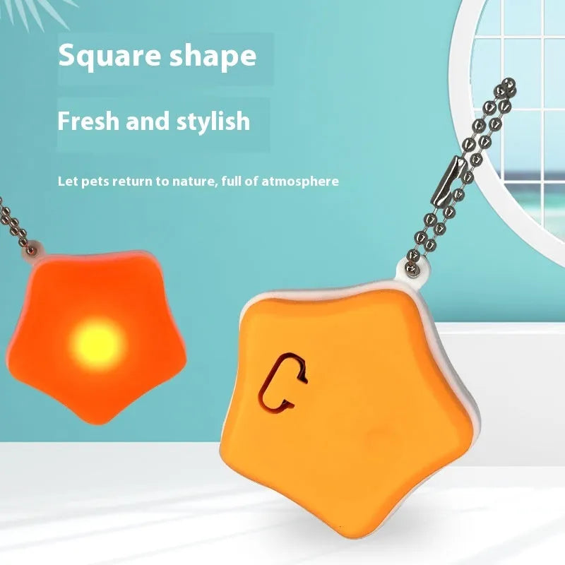 Blue and orange silicone rechargeable pendant light for pet collars, showing LED on.