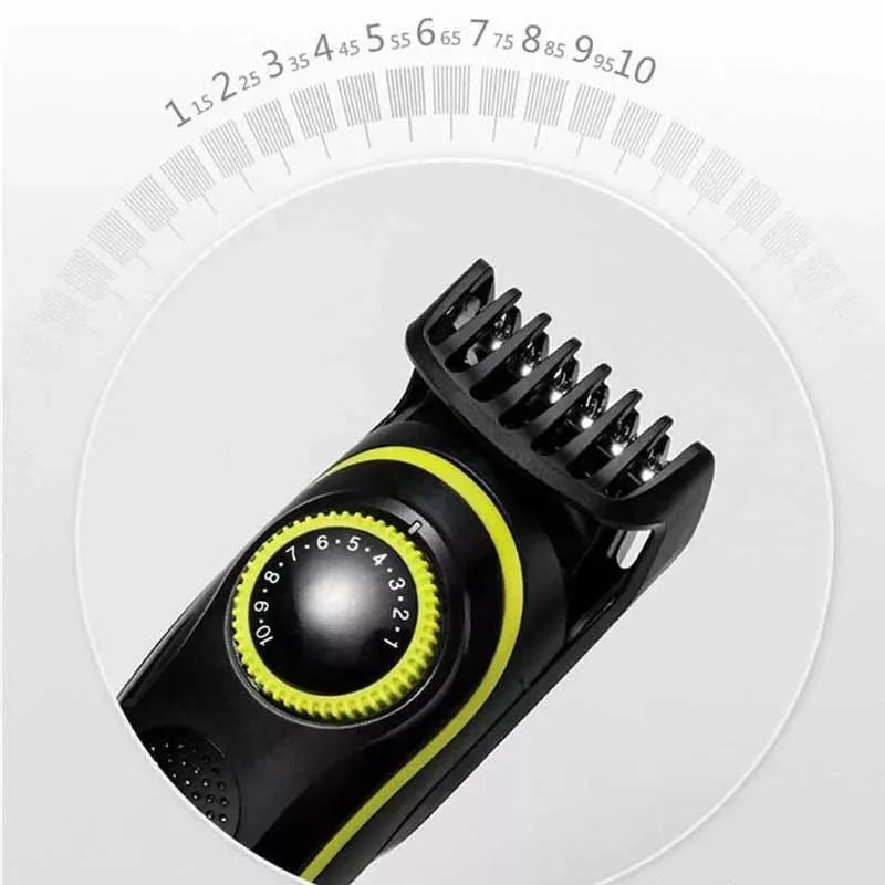Black household electric hair clipper model KM-696 with USB cable and accessories on a plain background.
