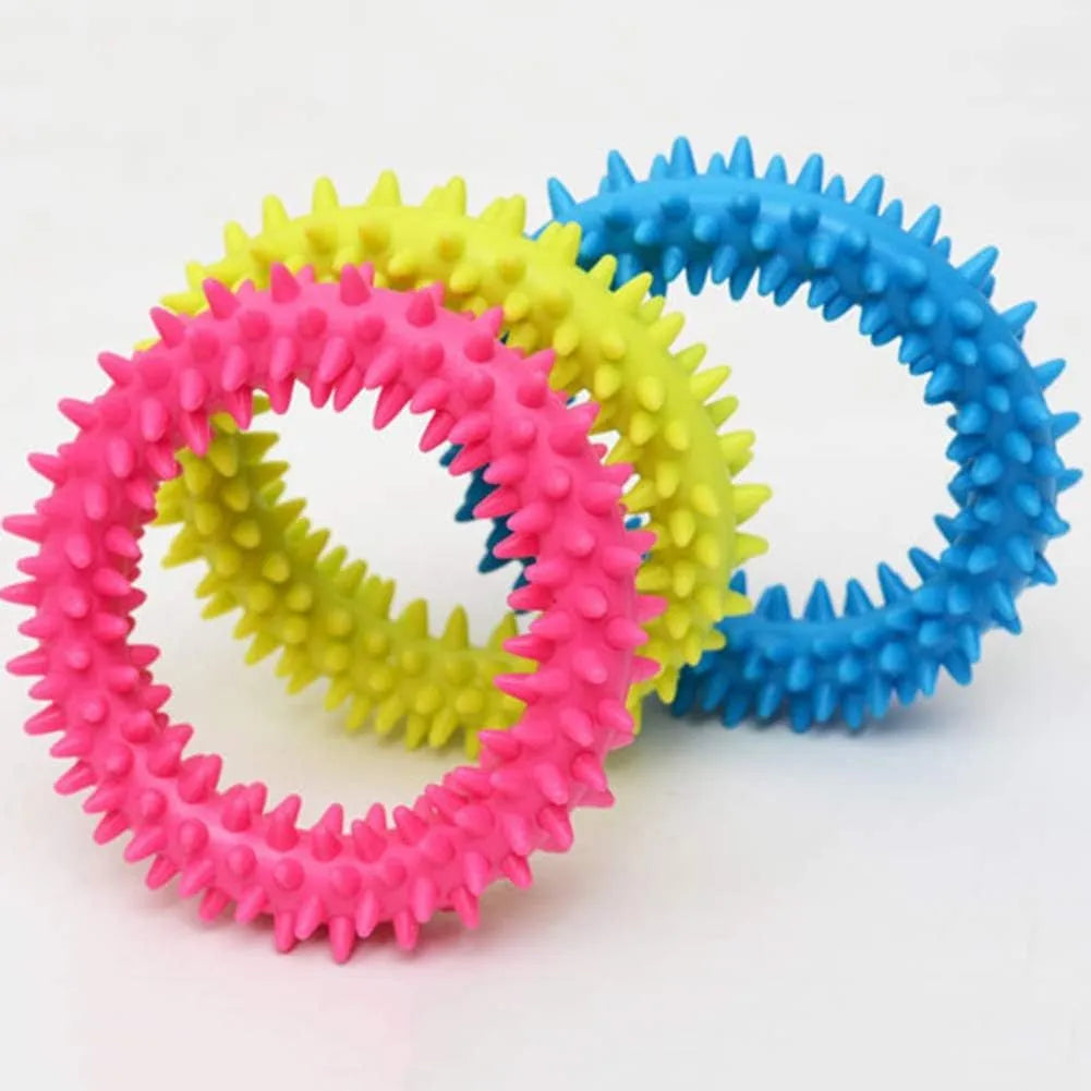 Blue spiky TPR ring dog chew toy for dental cleaning on a white background