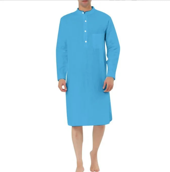 Man wearing a dark blue cotton shirt robe with a button front and chest pocket.