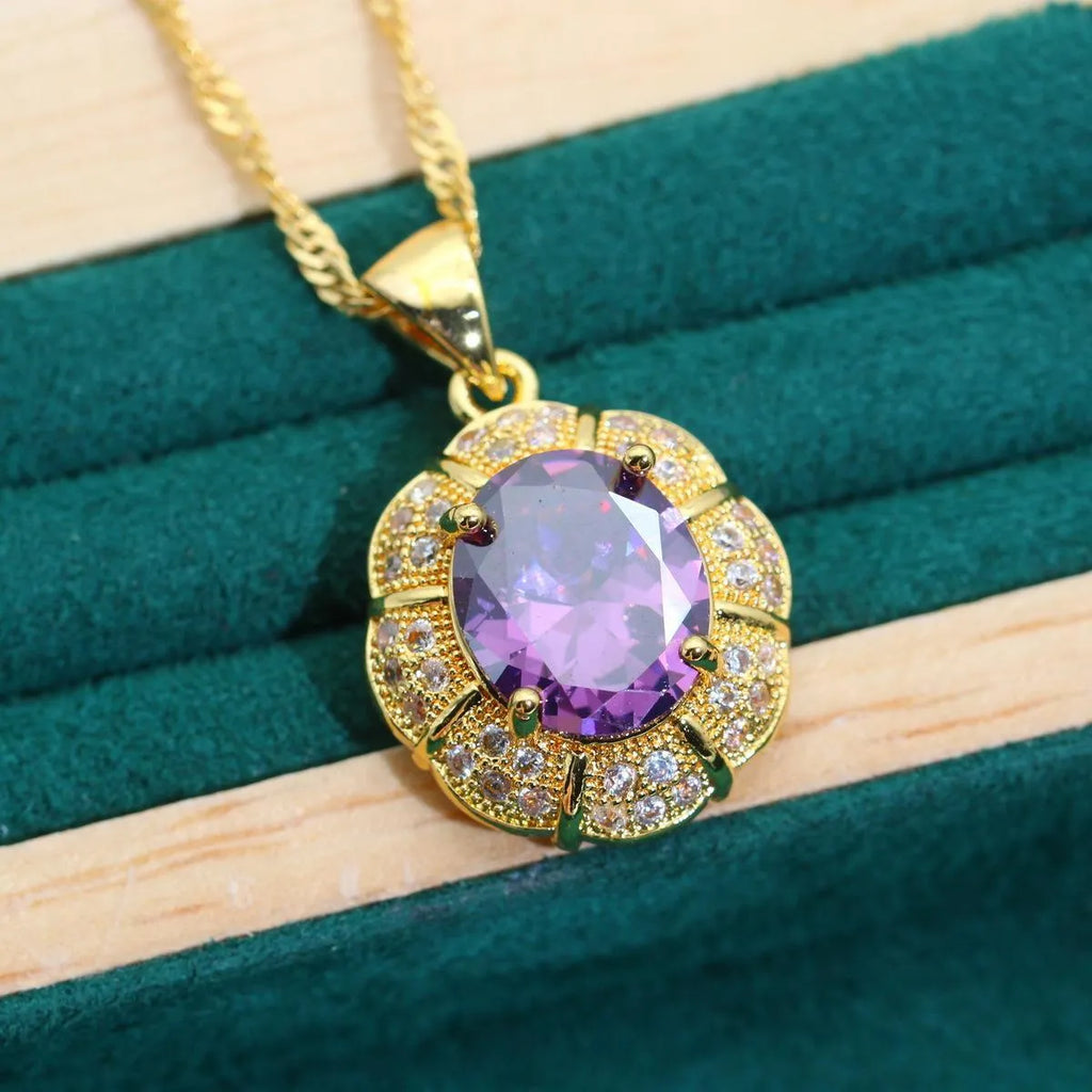 18k gold plated jewellery set with coloured cubic zirconia stones, showing necklace, earrings, ring, and bracelet.