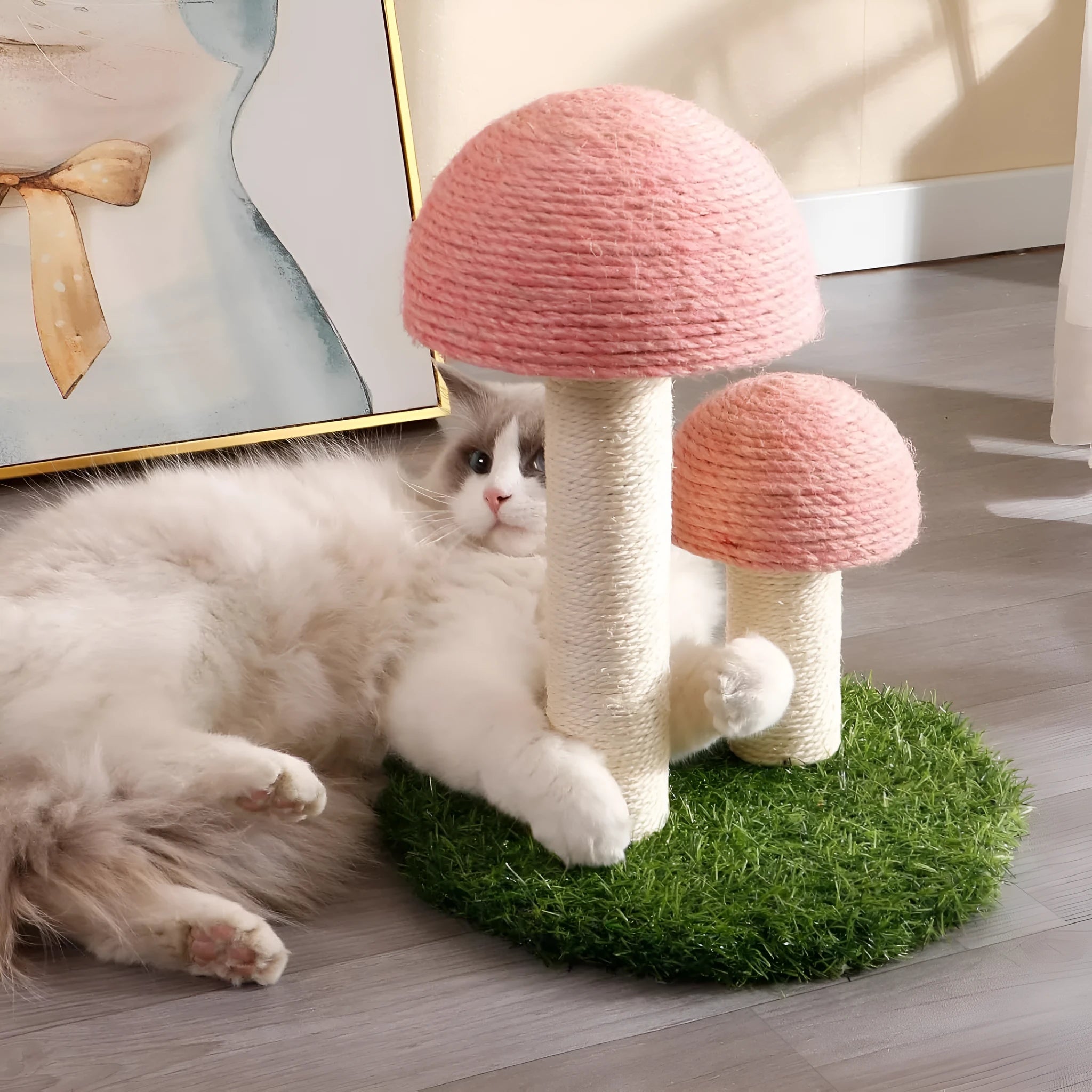 Pink mushroom-shaped cat scratching post made from natural sisal with a sturdy base.