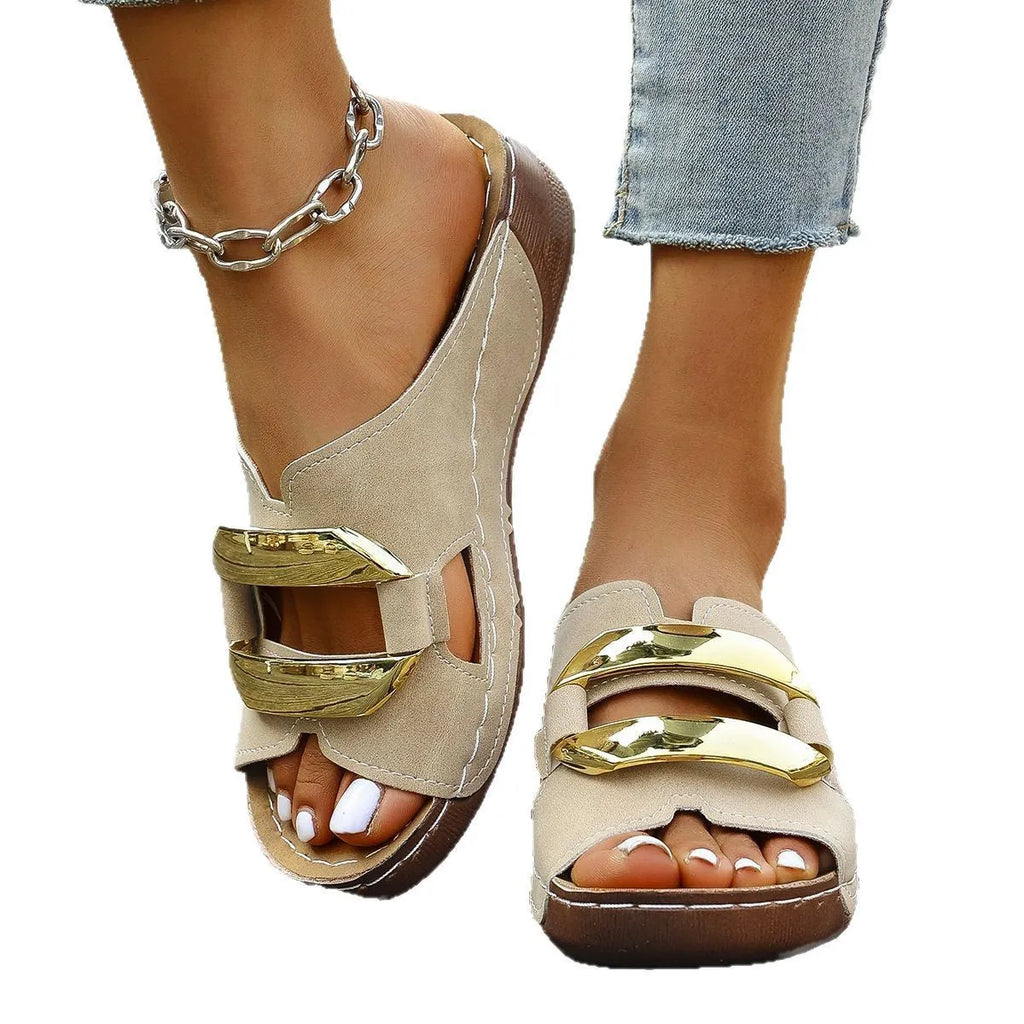 Pair of Roman-style platform flip-flop sandals on a solid colour background.