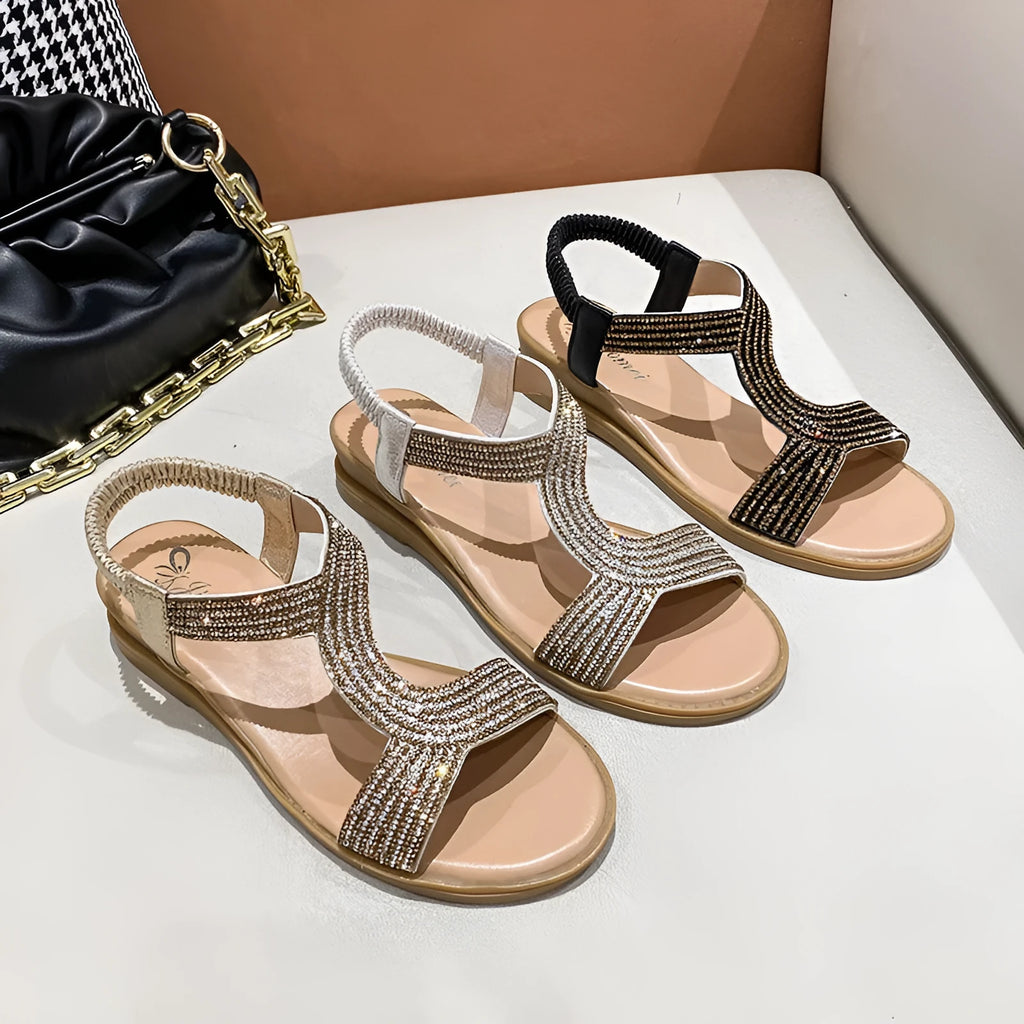 Gold women's patent leather beach sandals with round toe, rhinestones, and a non-slip sole.