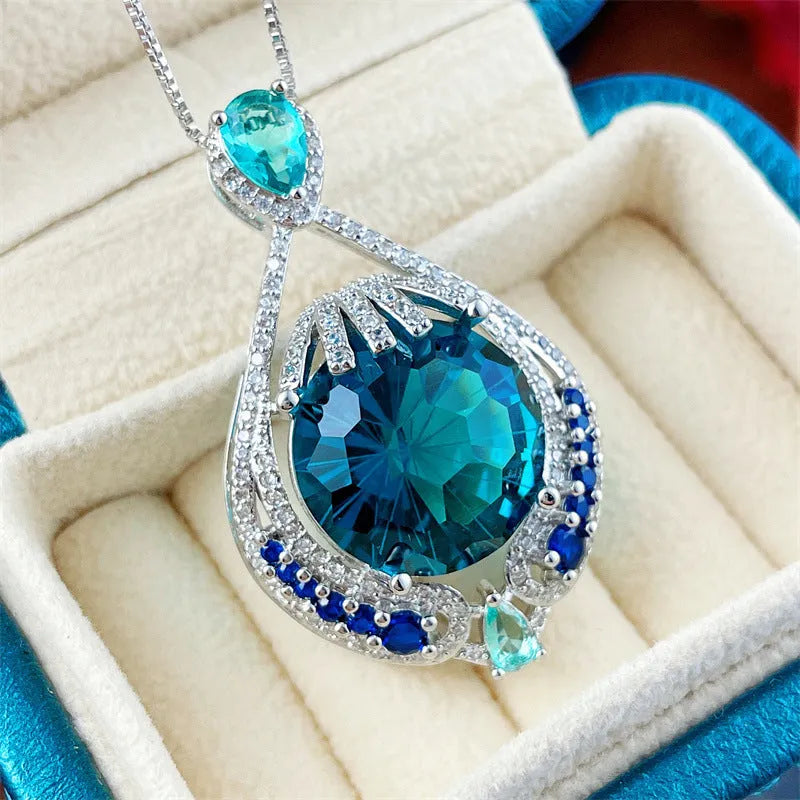 Blue geometric pendant necklace with fireworks cut crystal gems on water wave chain