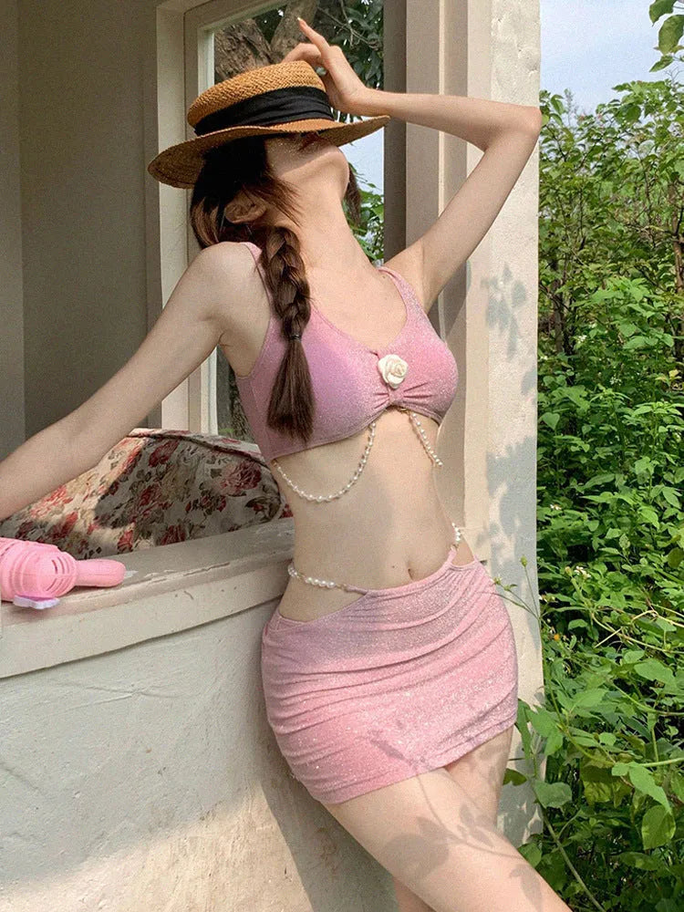 Women's pink and black three-piece polyester bikini set with briefs style and backless design