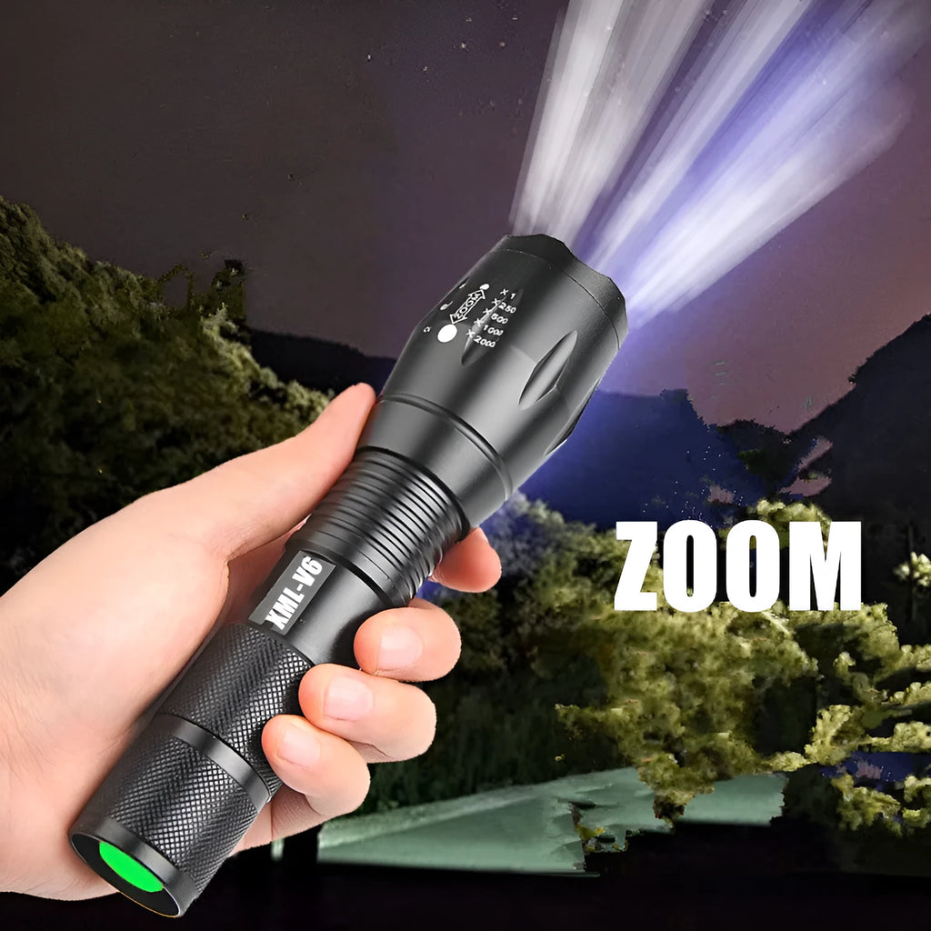 Black aluminium zoom flashlight showing adjustable head for focus, next to an 18650 battery.