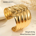 Women's exaggerated wide stainless steel bracelet with 18K gold plating and wave geometric design.