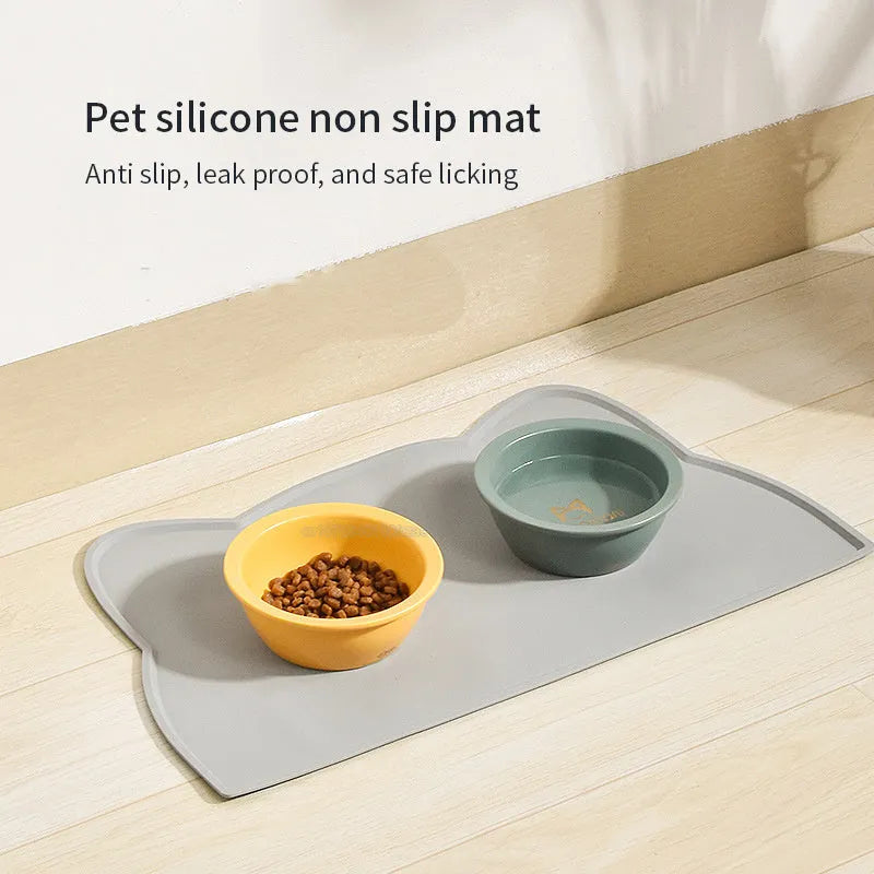 Blue silicone pet feeding mat measuring 44cm by 24cm under a dog bowl