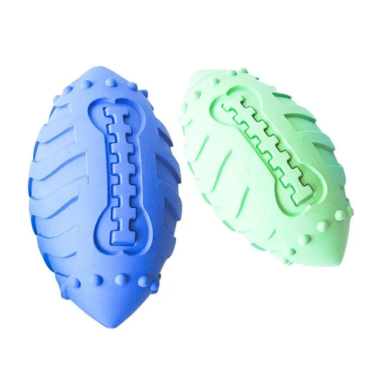 Light green rubber rugby ball dog toy with textured teeth cleaning surface