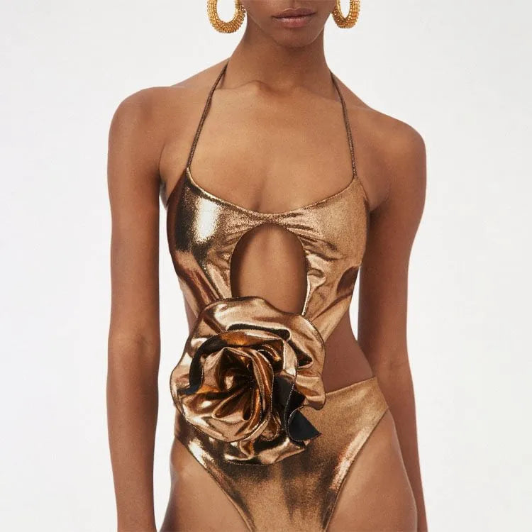 Gold handmade halter one-piece swimsuit with hollow-out design on mannequin
