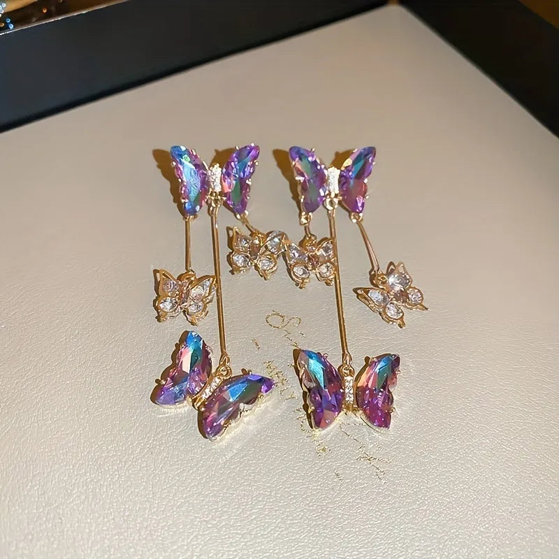 Silver needle crystal flowers butterfly tassel earrings in blue purple colour on alloy hooks