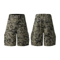 A pair of grey loose-fit cotton workwear shorts with a half-elastic waistband and side zipper on a neutral background.