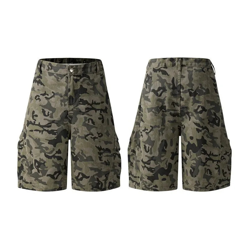 A pair of grey loose-fit cotton workwear shorts with a half-elastic waistband and side zipper on a neutral background.
