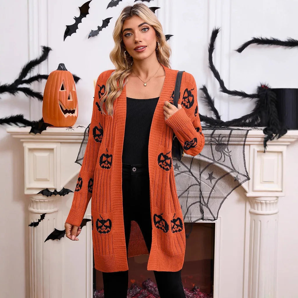 Women's black Halloween cardigan with orange pumpkin head jacquard knit pattern.