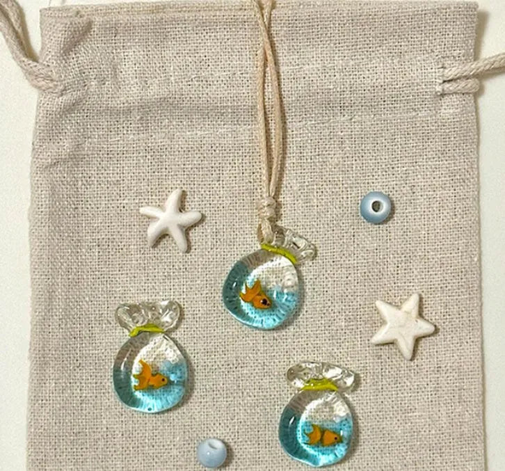 Women's pendant necklace with coloured glaze skirt joker character on a cotton linen clavicle chain.